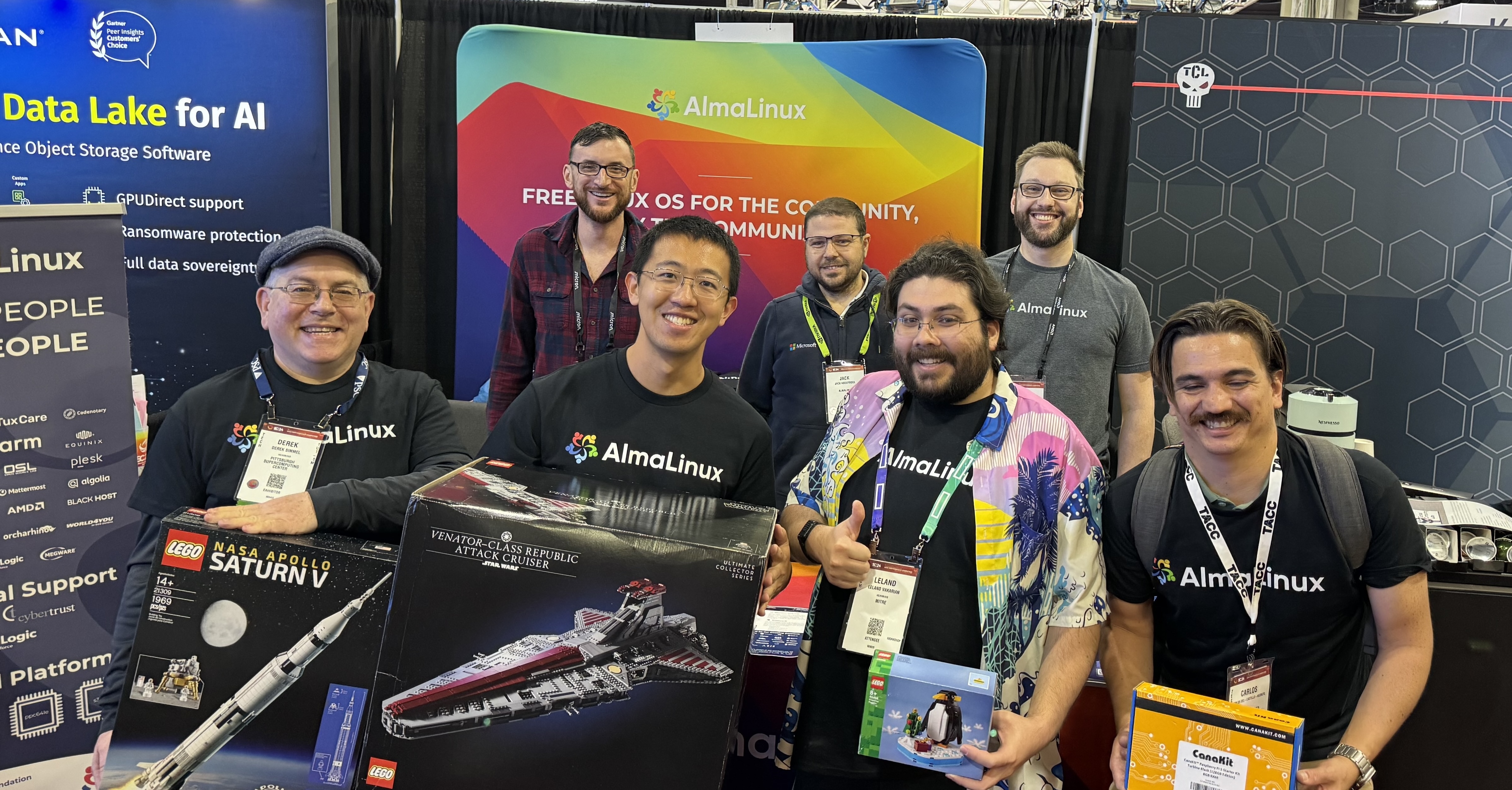 AlmaLinux community members at the SC24 conference booth